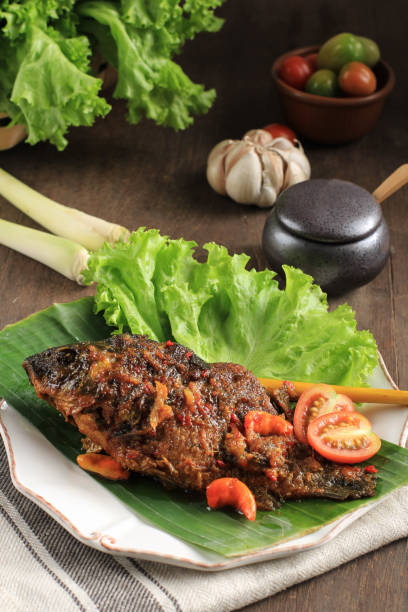 Pesmol Fish Using Goldfish. Add Fried Fish to the Pan. Pesmol Typically Fish Recipe from West Java, Indonesia, with Sweet, Sour, and Spicy Taste