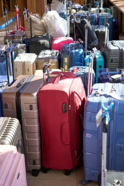 istock Many suitcases of travelers lined up 1973777135