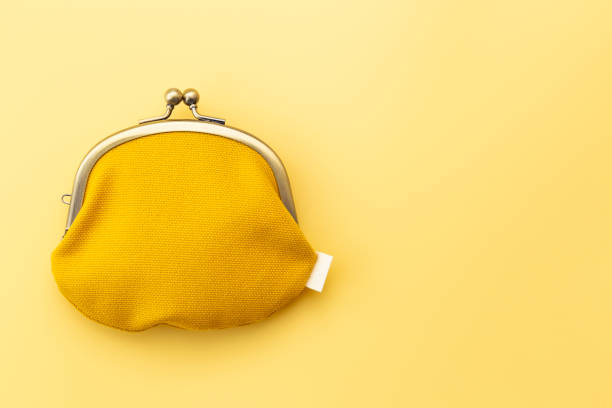 istock Coin purse on a yellow background. 1973811707