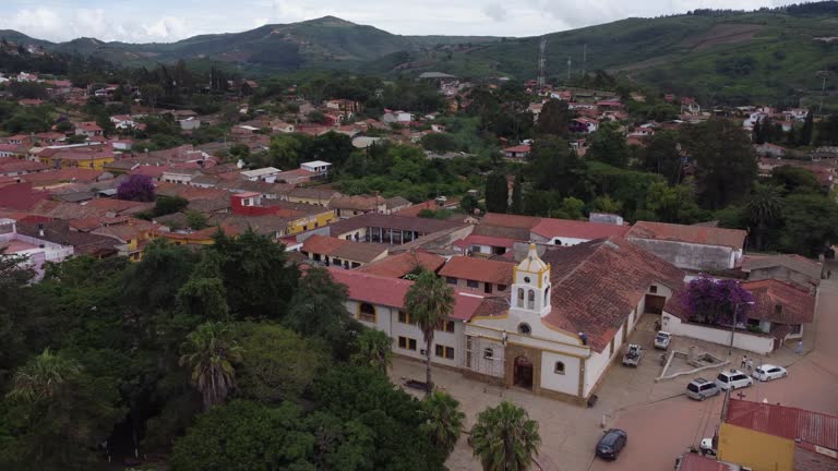 Men work on facade of Our Lade of Candelaria church, Samaipata Bolivia