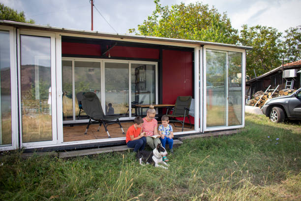 istock Family on vacation in their container house 1973880590
