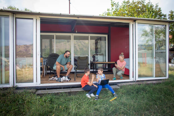 istock Family on vacation in their container house 1973880608