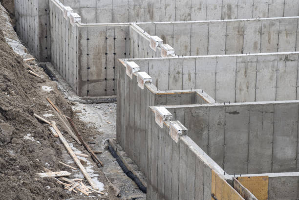 istock Concrete walls of basement foundation with weeping tile at a construction site 1974018656