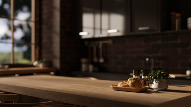 istock A space for displaying your product on a hardwood dining table in a modern, dark kitchen. 1974018878