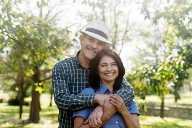 istock Elderly couple share a tender moment at the park 1974020951