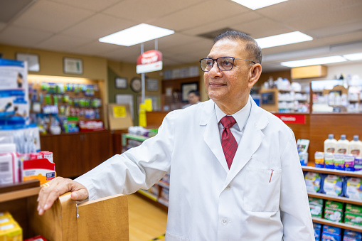 Customers and pharmacists interact inside a pharmacy