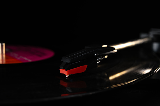 Detail shot of a record playing on a record player.