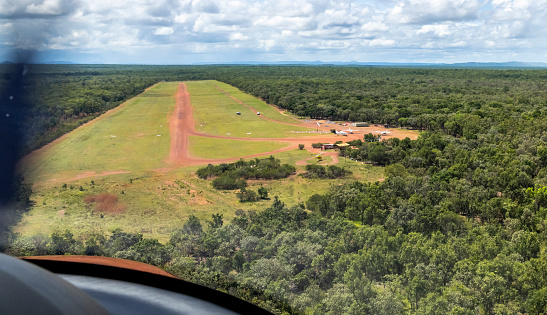 Landing in the outback on a dirt strip , in Australia.