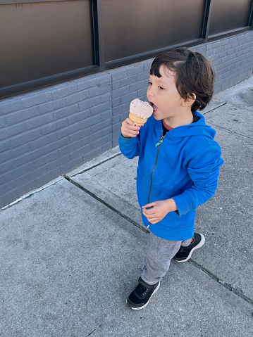 View of a boy eating an ice cream