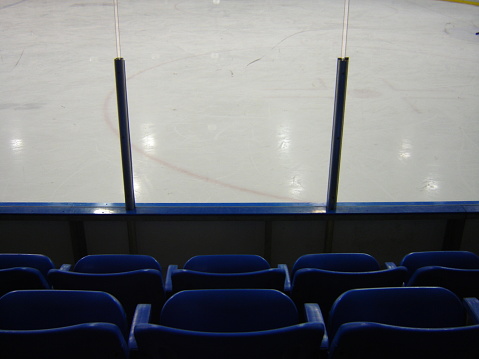 Close up view of arena seating by the ice