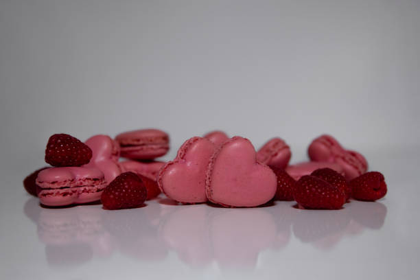 istock Pink heart-shaped macaroon with raspberries 1974151913