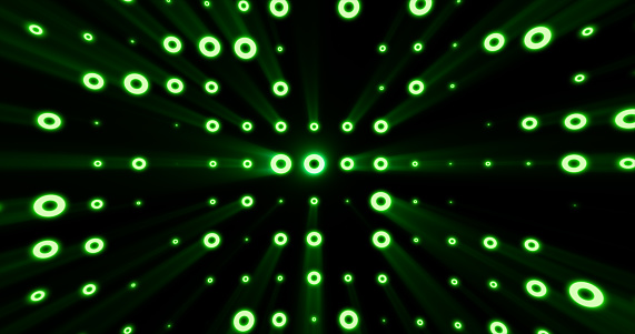 Abstract background of bright green glowing light bulbs from circles and dots of energy magic disco wall.