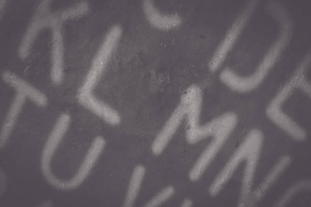 istock light shadow of the alphabet on a dark background 1974196660