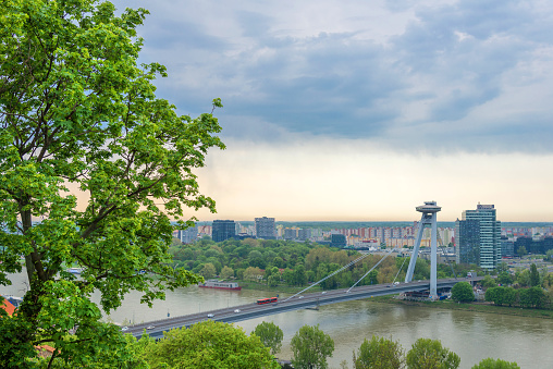 Bratislava cityscape view on the southern part of the city with bridge and Danube river in spring. High quality photo
