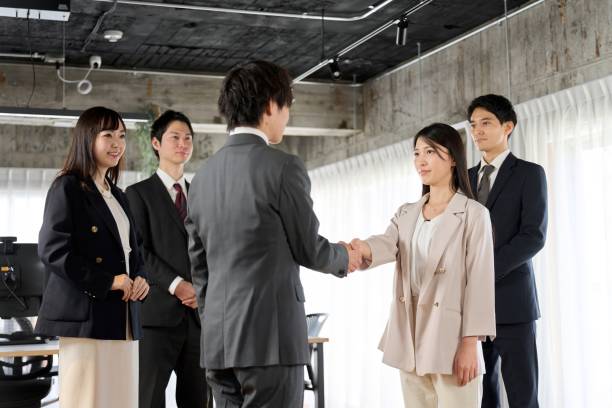 istock Asian business people shaking hands in the office 1974293357