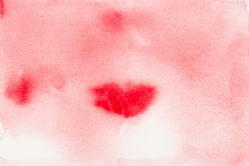 Soft watercolor diffusion with a heart-like red blush at its center.