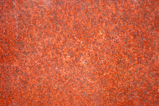 stone texture. Smooth, polished red and orange stone surface. Elegant, glossy finish, luxurious backgrounds. sophistication and warmth to design