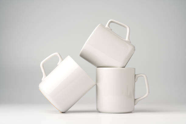 istock Blank white mugs mock up on white background 1974330494