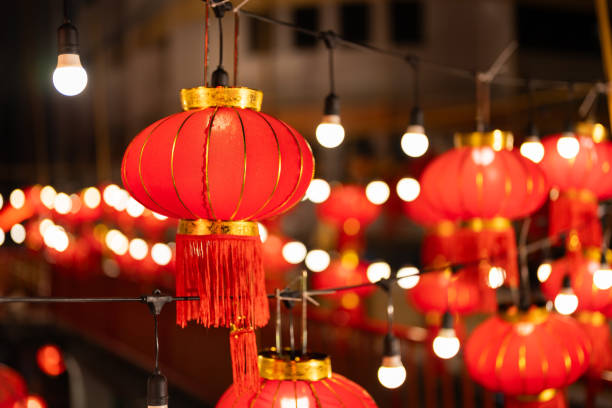 istock Red Chinese lanterns hung in rows with bright bulbs. It is displayed on Chinese New Year and festivals celebrating Chinatown in Asia and the civilization of people of Buddhist descent. 1974332061
