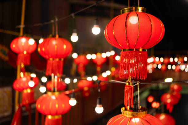 istock Several red Chinese lanterns hanging on the overpass with light bulbs and bokeh The Chinatown area in Asia on Chinese New Year and festivals is a civilization of people of Buddhist descent. 1974332568
