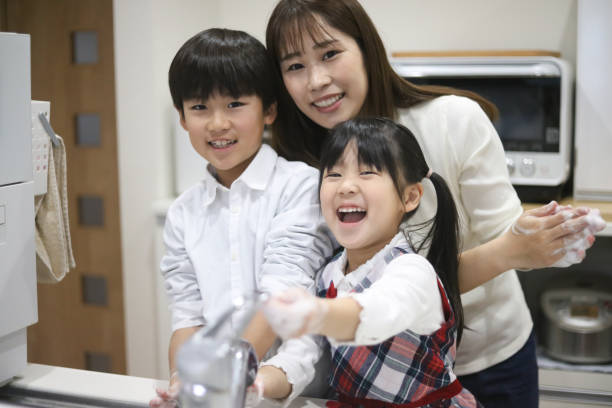 istock Parent and child washing hands 1974352259