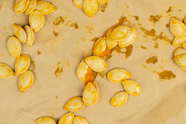 Orange pumpkin seeds close up, seeds from an old orange pumpkin