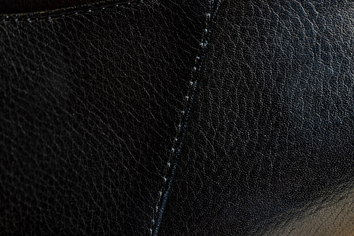 parts and details of clothing made of black leather, close-up of black leather