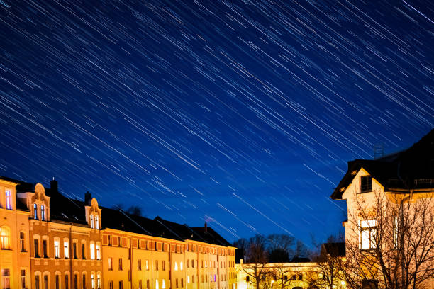 Star trail effect made during a clear night with blue sky lighted by the moon in Chemnitz, Germany.