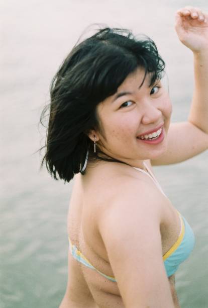 istock cheerful Thai woman at sea 1974449376