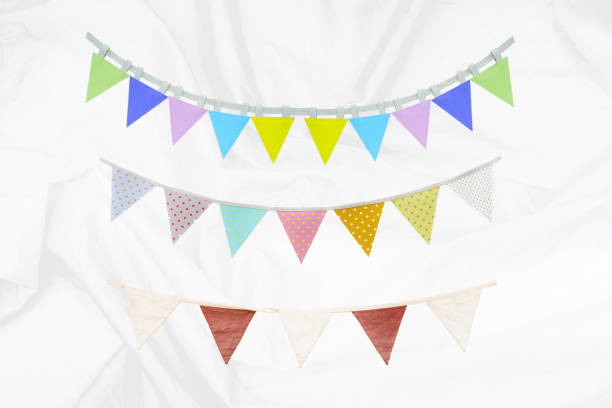 istock Fabric bunting flag vintage style on white fabric texture background 1974462473