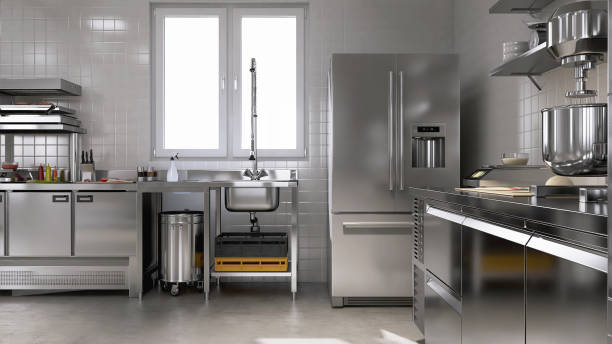 istock Stainless steel washing sink, cabinet, shelf, table with utensils, kitchenware, in white tile wall commercial, professional restaurant, bakery kitchen in sunlight from window in background 1974525873