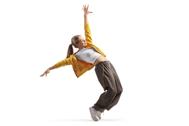 Teen girl dancing on tiptoes, hip hop style concept Teen girl dancing on tiptoes, hip hop style concept, isolated on white background dancer stock pictures, royalty-free photos & images