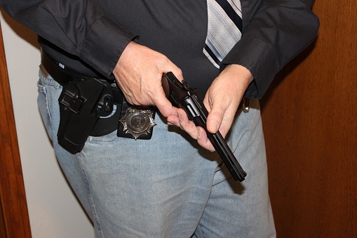 male detective with weapon, pointing, checking, holding, close up