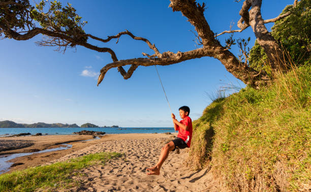 istock Kid enjoying holidays spending time at beach. 1974568713
