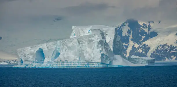 Photo of Massive tip of an iceberg on the coast of the Antarctic Peninsula, Antarctic mainland