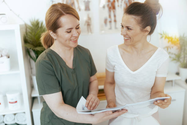 istock happy female massage therapist conduct educational training 1974633835