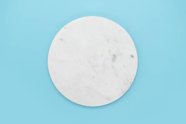 istock Round marble podium on blue background 1974656725