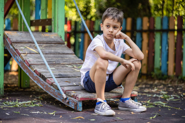 istock Sad kid on the playground 1974665316