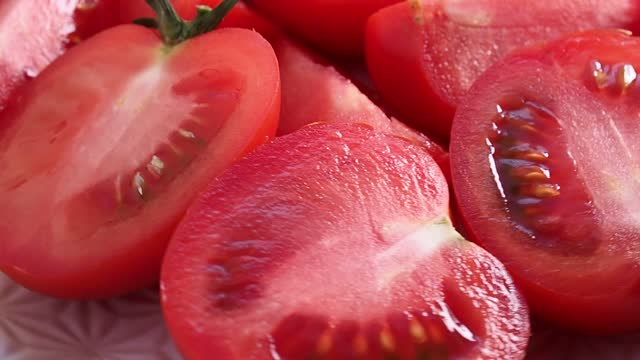 Juicy ripe red tomato close up. Rotating in a circle. Healthy diet vegetables.