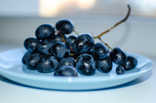 Delicious washed ripe grapes waiting to be eaten