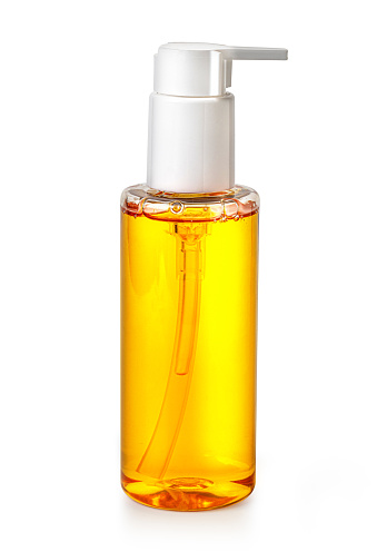 Orange  Glass Soap Dispenser Pump Bottle Isolated on White Background. Skin Care Lotion. Bathing Essential Product. Shampoo Bottle. Bath and Body Lotion. Fine Liquid Hand Wash. Bathroom Accessories