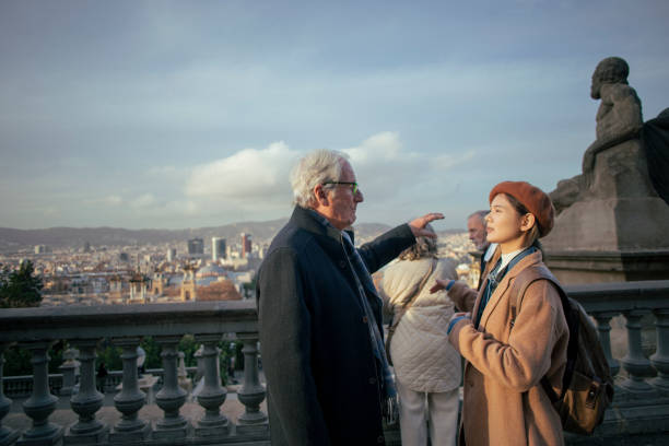 istock Senior friends with guide visiting the city 1974685188