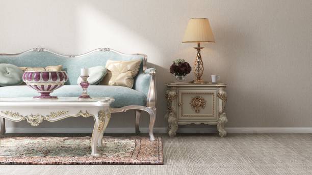 istock Classic pastel turquoise blue victorian sofa, coffee table, cabinet on rug, carpet floor, in sunlight on beige wall room 1974708032