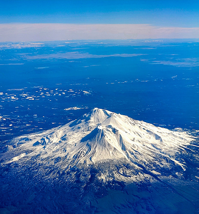 An aerial view of Mount Saint Helens covered in snow during winter