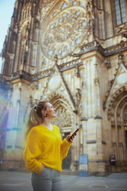 istock woman in Prague exploring attractions, using phone and walking 1974716177