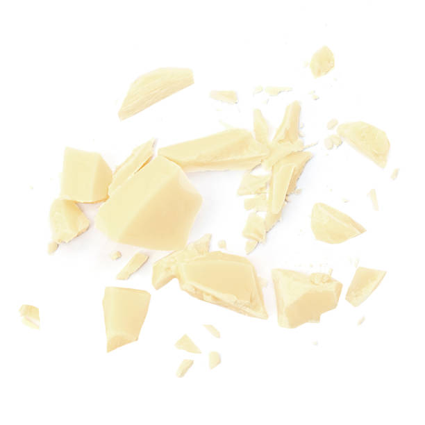 istock White milk chocolate chunks isolated on white background. Chocolate pieces with  crumbs Top view. Flat lay 1974739978