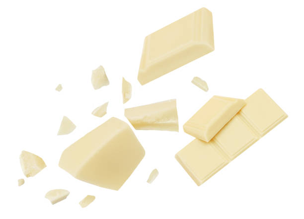 White Chocolate explosion isolated on white background. Shattering Chocolate pieces package design.