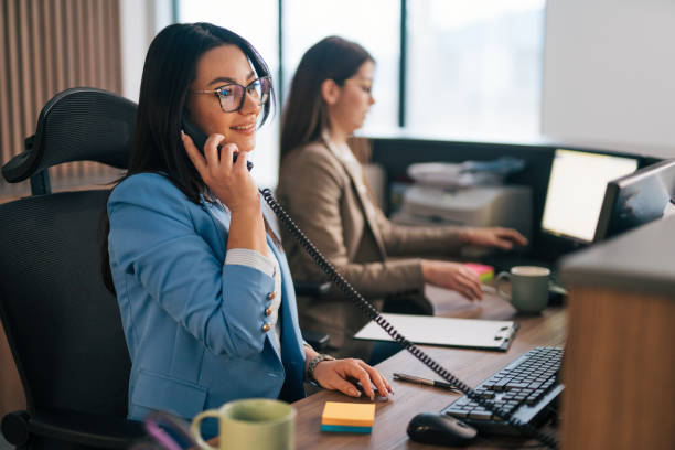 istock a young consultant working in a telephone sales office. 1974739995