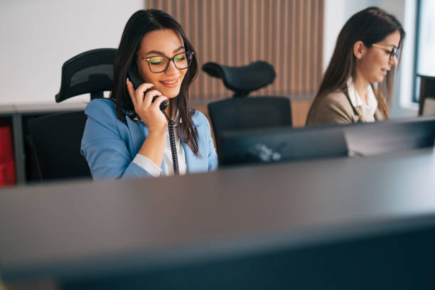 istock a young consultant working in a telephone sales office. 1974741568