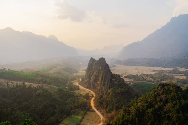Scenic view of valley with karst mountains at sunset visible from viewpoint